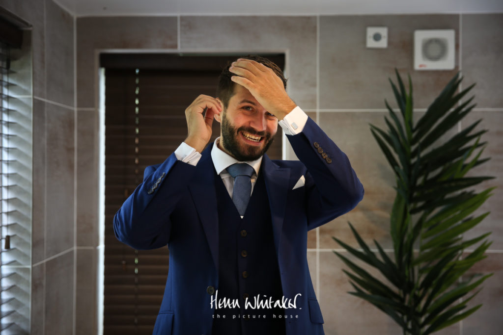 wedding photographer gilpin lake house - groom getting ready