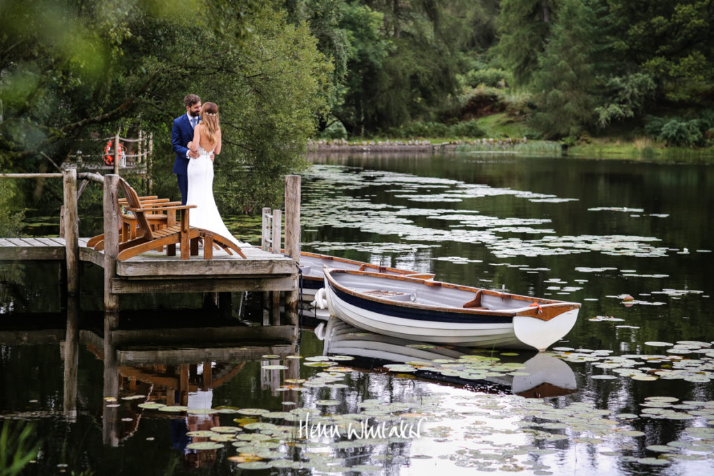 Wedding photographer gilpin lake house - bride & groom on the lake