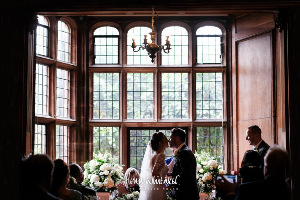 Documentary wedding photographer Thornton Manor Cheshire first kiss