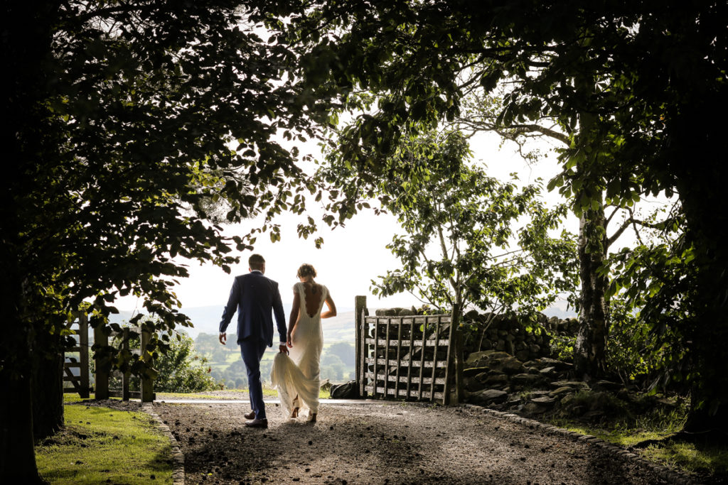 lake district documentary wedding photographer Knipe Hall bride and groom in trees