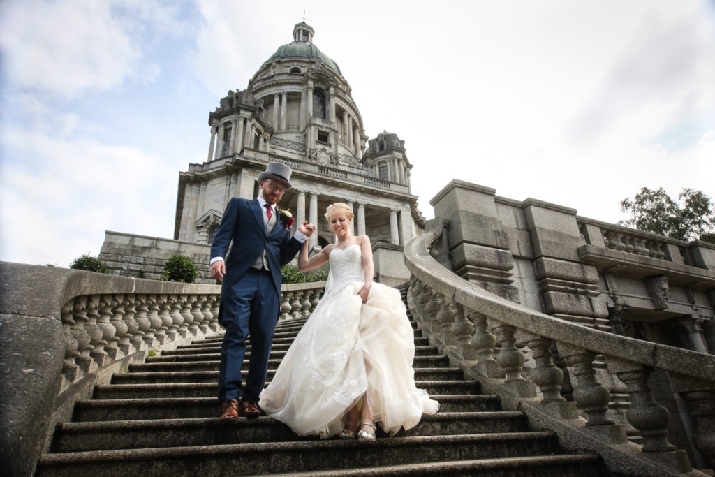 lake district documentary wedding photographer Ashton Memorial couple on steps