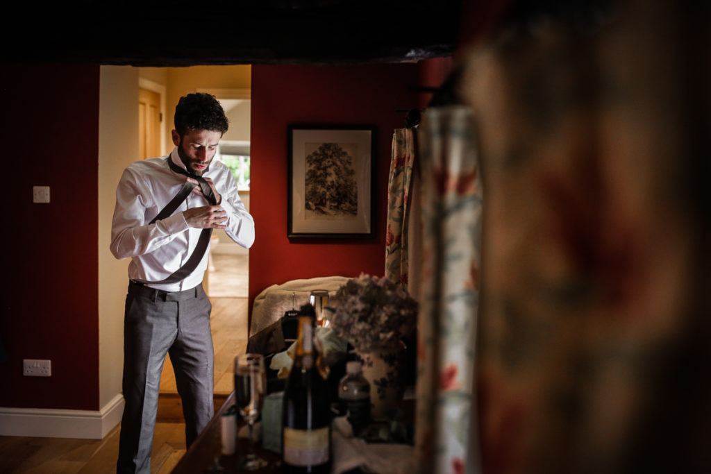 lake district documentary wedding photographer Melmerby Hall groom prep