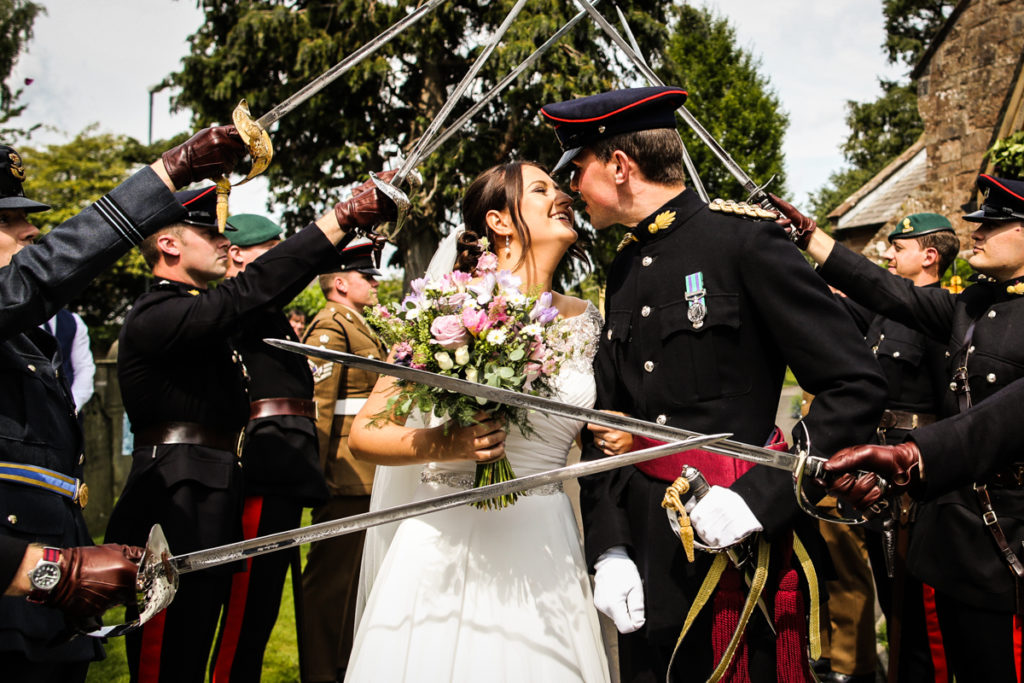 lake district documentary wedding photographer Cumbrian military wedding confetti and swords