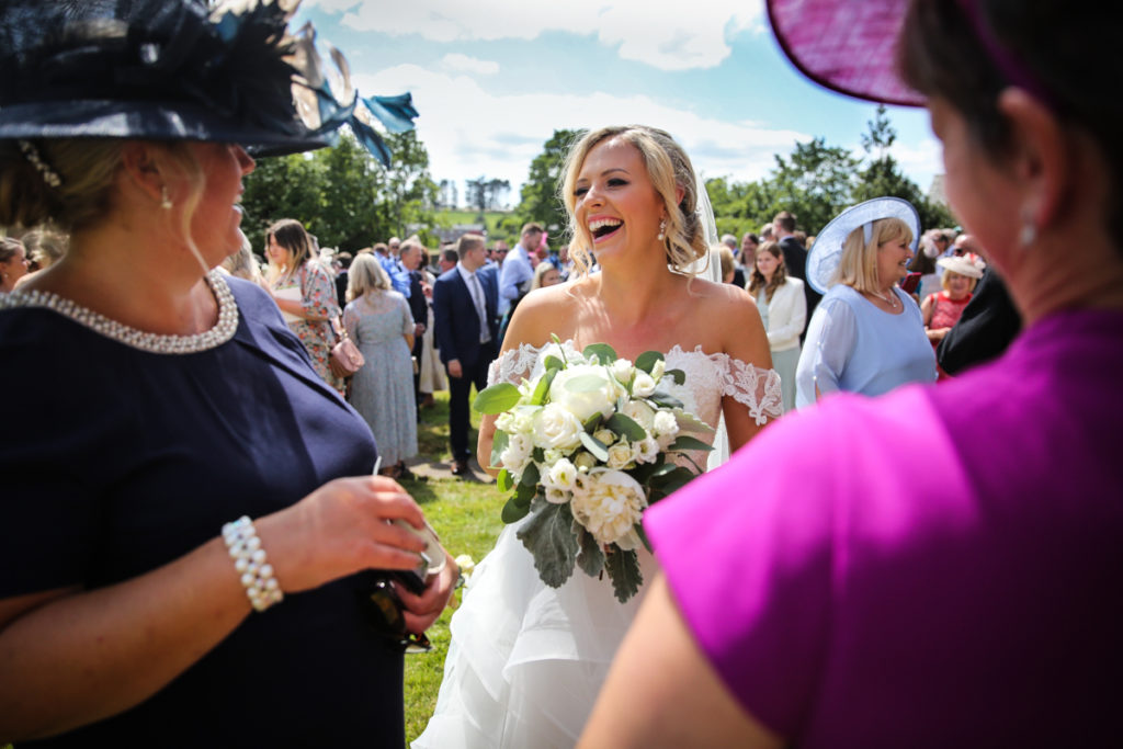 lake district documentary wedding photographer bride and guests in the sunshine