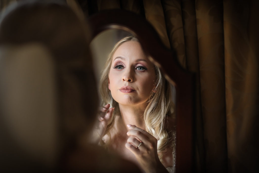 lake district documentary wedding photographer bride in the mirror Armathwaite Hall