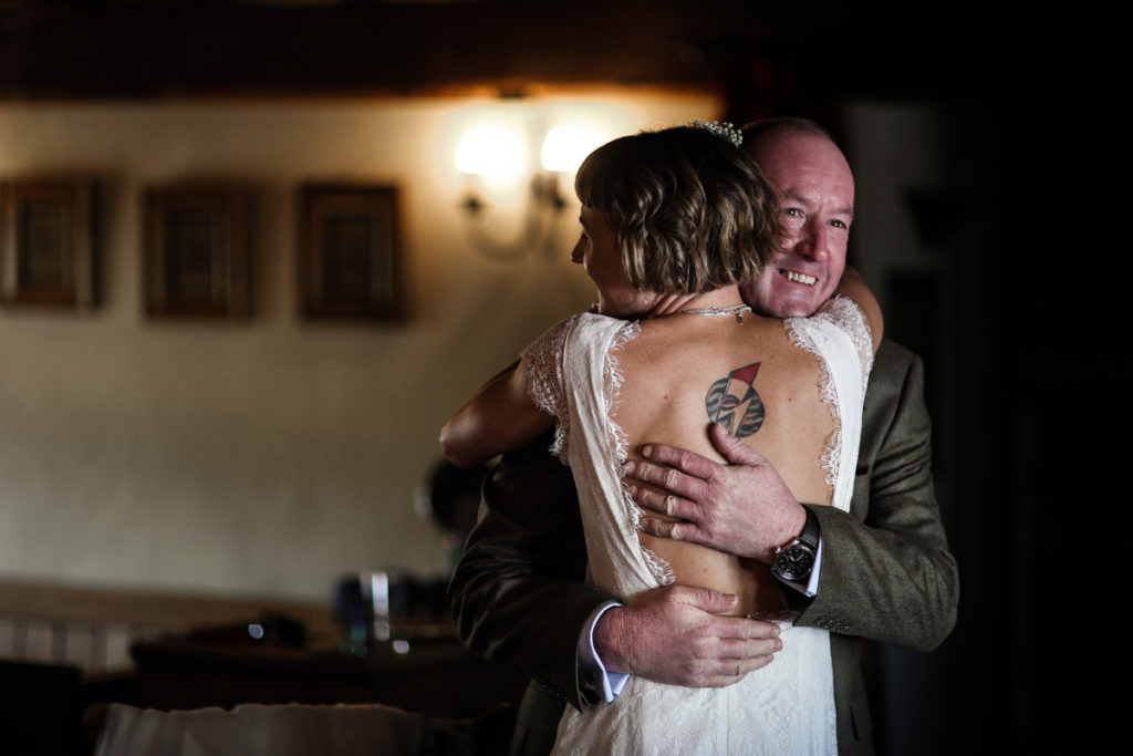 Knipe Hall bride hugging father Lake District wedding photographer