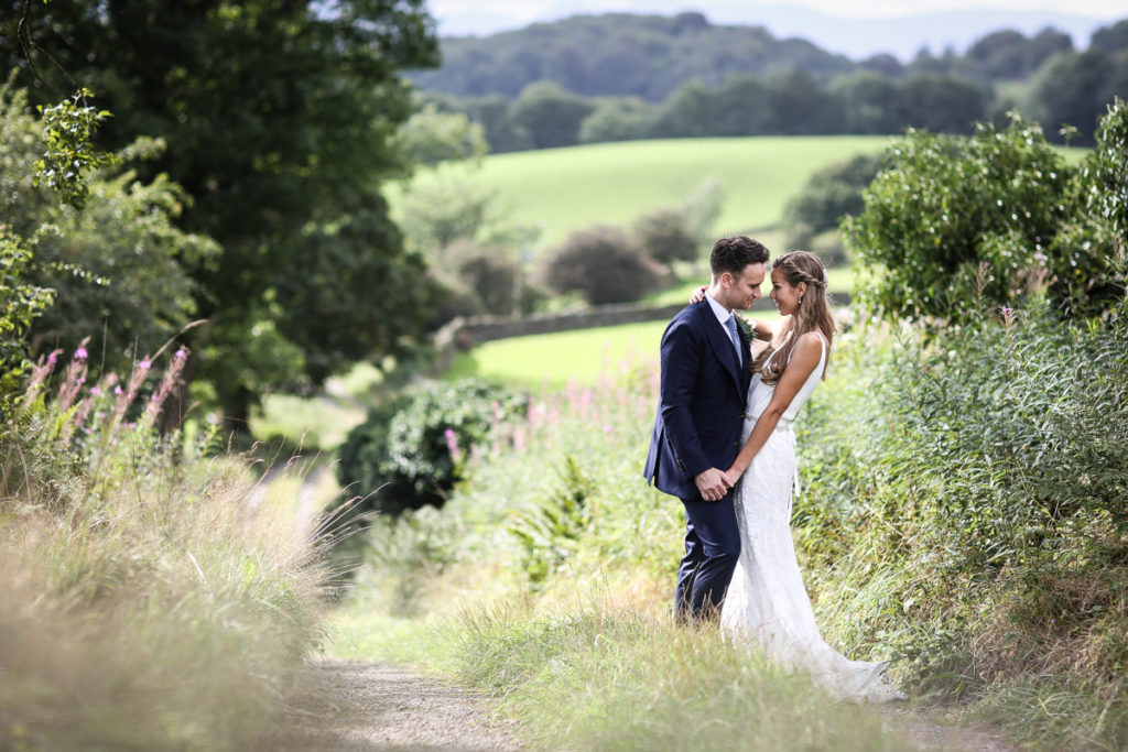 lake district documentary wedding photographer couple portrait in the fields