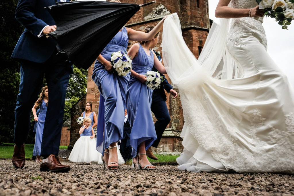 lake district documentary wedding photographer wedding party leaving the church