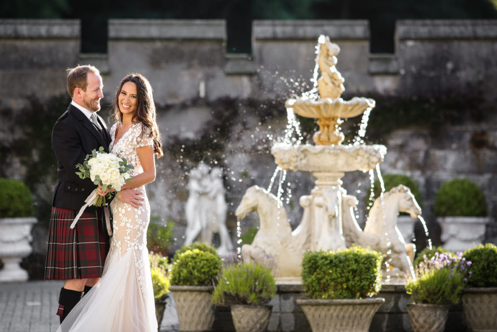 lake district documentary wedding photographer Dundas Castle couple portrait with fountain