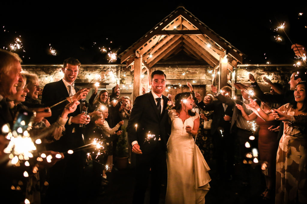 lake district documentary wedding photographer Askham Hall bride and groom sparkler shot