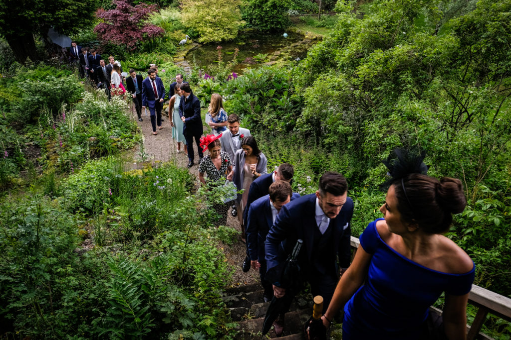 lake district documentary wedding photographer Askham Hall guests walking