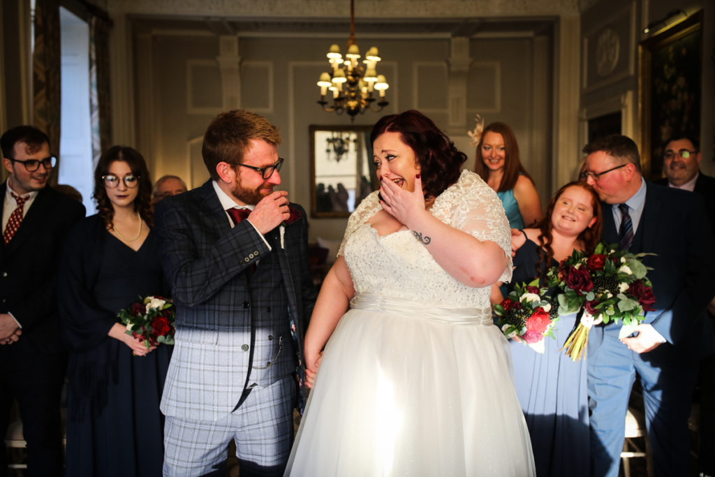 lake district documentary wedding photographer Storrs Hall Bride and groom laughing