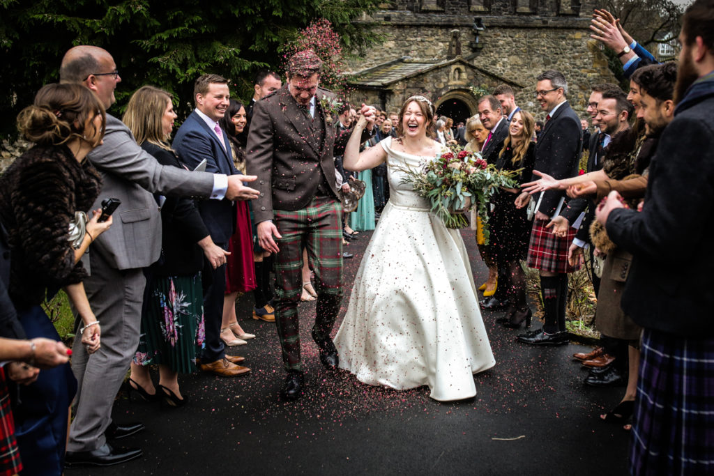 lake district documentary wedding photographer Sedbergh church wedding with confetti