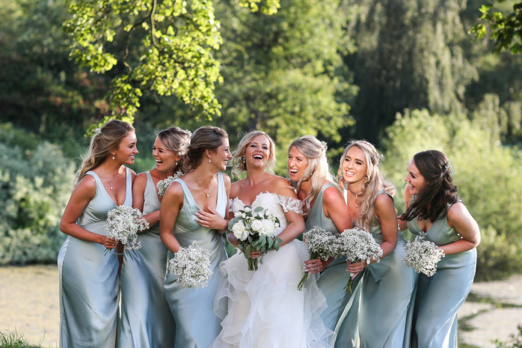 lake district documentary wedding photographer Greystoke Castle bridesmaids laughing