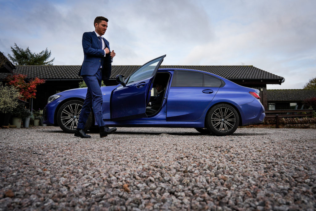 lake district documentary wedding photographer groom with blue car