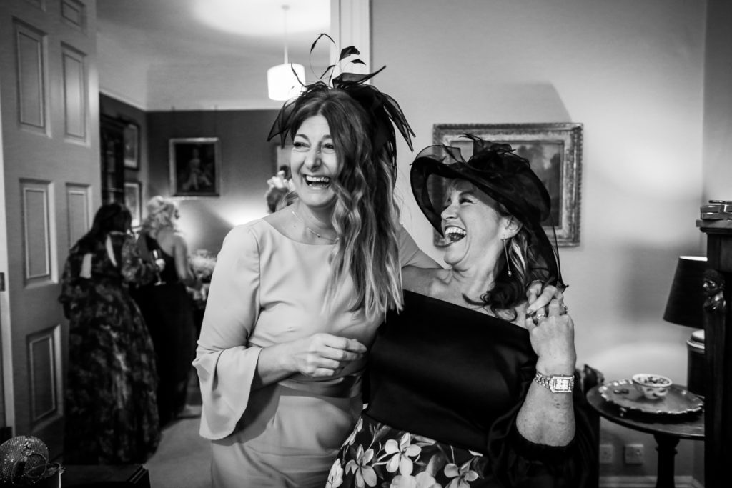 lake district documentary wedding photographer guests laughing black and white