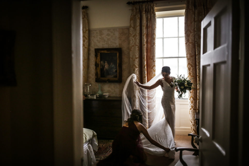 lake district documentary wedding photographer bride in window