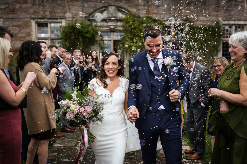 lake district documentary wedding photographer Askham Hall confetti and bubbles