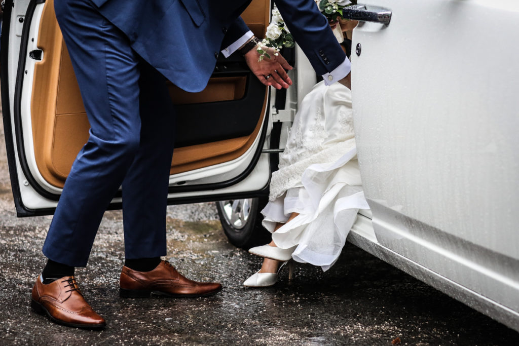 lake district documentary wedding photographer brides feet and car