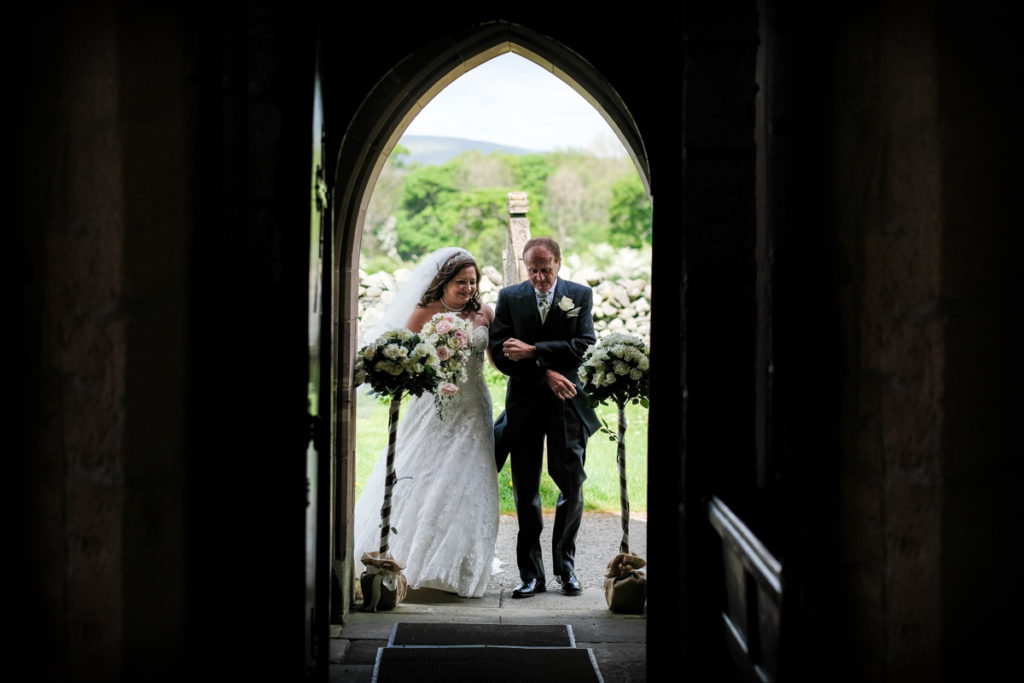 lake district documentary wedding photographer brides entrance into the church