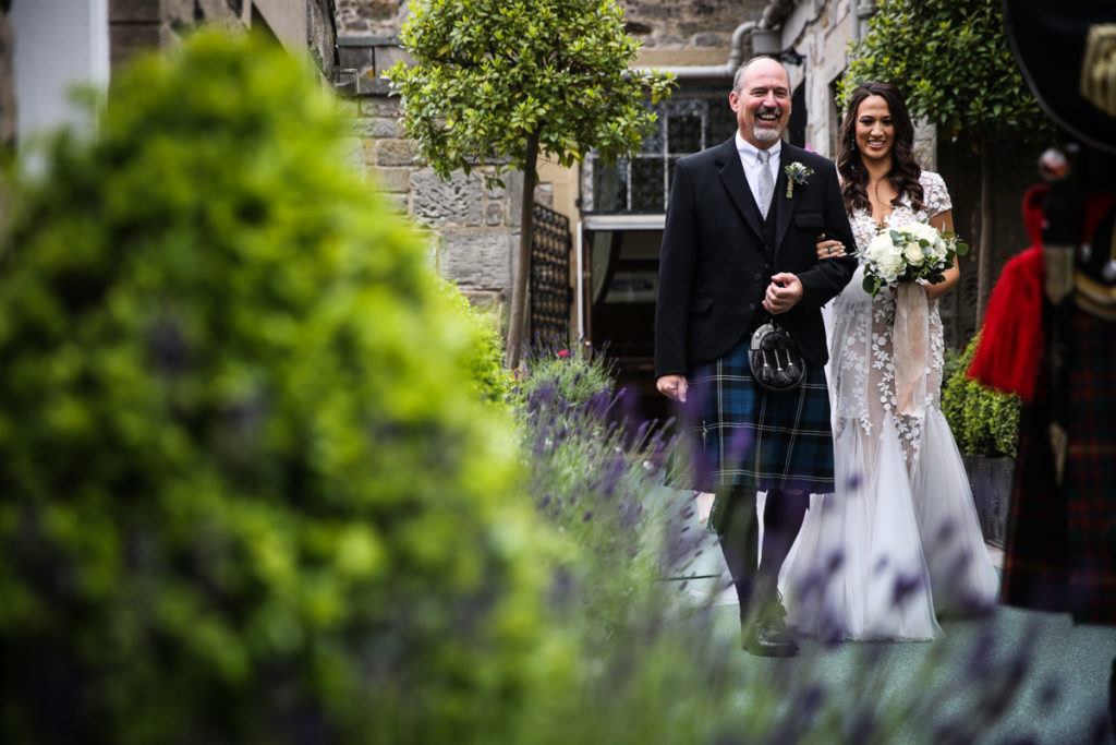 lake district documentary wedding photographer Dundas Castle father and bride walking