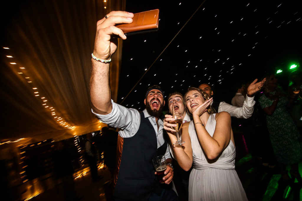 lake district documentary wedding photographer guests dancing