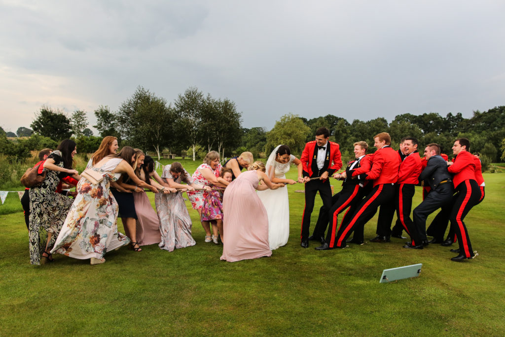 lake district documentary wedding photographer Garden at Eden tug of war