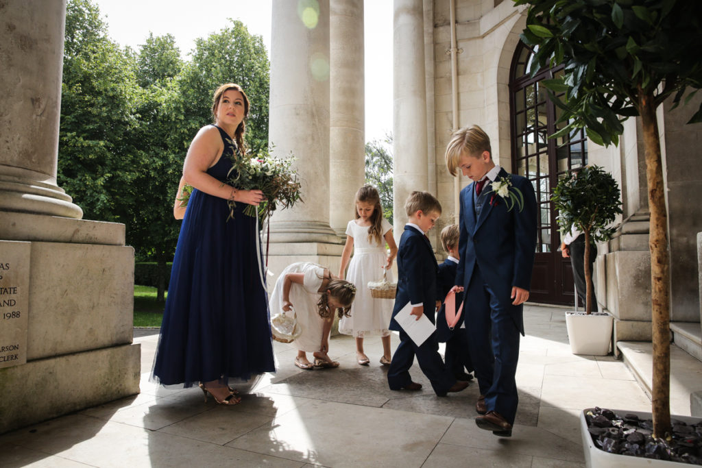 lake district documentary wedding photographer Ashron Memorial bridesmaids and pageboys on steps