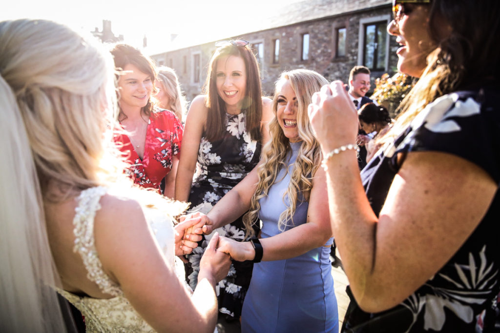 lake district documentary wedding photographer Armathwaite Hall wedding guests laughing