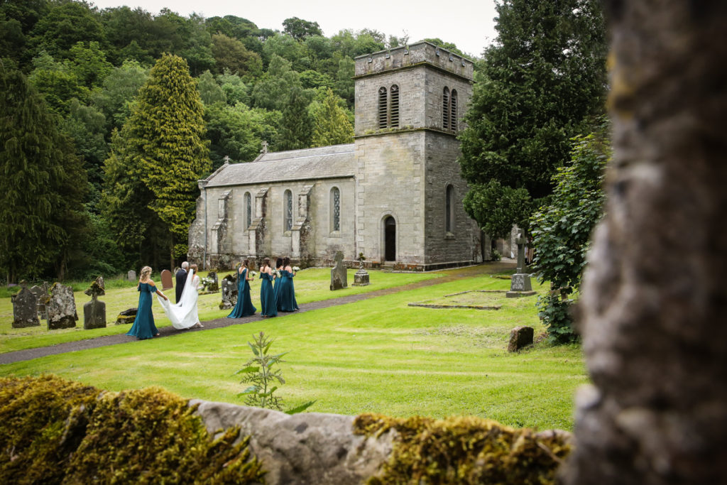 lake district documentary wedding photographer Askham Church wedding party arriving